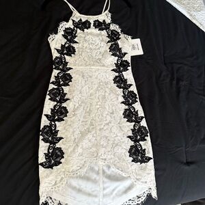 Elegant White Lace Dress with Black Floral Accents